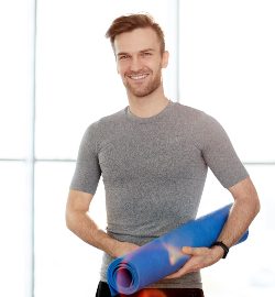 handsome-yoga-instructor-with-exercise-mat-2021-09-24-04-14-35-utc-2.jpg